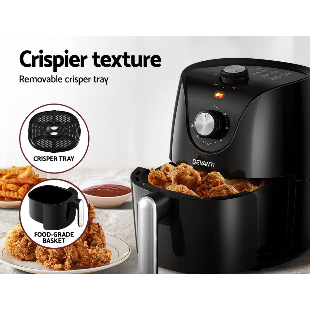 Black air fryer with fried chicken, highlighting removable crisper tray and food-grade basket