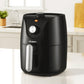 Black Devanti air fryer with timer knob on kitchen countertop