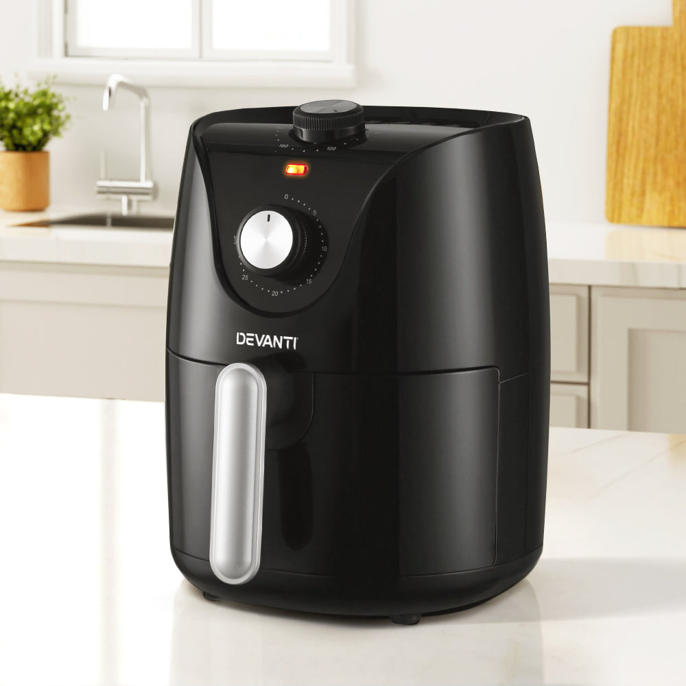 Black Devanti air fryer with timer knob on kitchen countertop