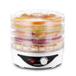 Electric food dehydrator with adjustable temperature dial drying sliced fruits on stackable trays