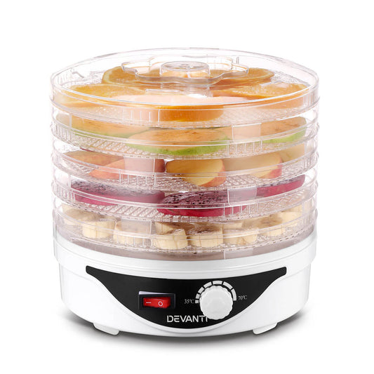 Electric food dehydrator with adjustable temperature dial drying sliced fruits on stackable trays