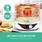 Electric food dehydrator with transparent trays and heat-cycling system on kitchen counter