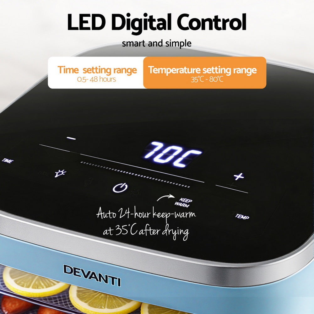 Digital food dehydrator with LED control panel, temperature and timer settings, sliced lemons inside.