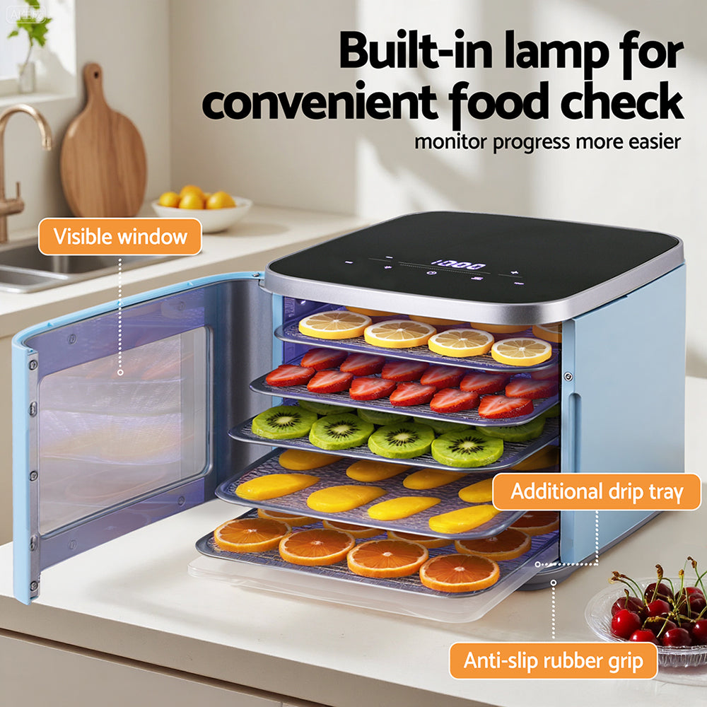 Food dehydrator with visible window and multiple trays drying sliced fruit in a kitchen